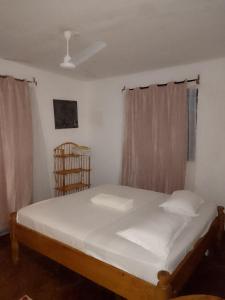 En eller flere senge i et værelse på HIGSAM apartment