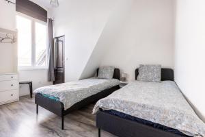 En eller flere senge i et værelse på Large house - 4 bedrooms & 4 bathrooms