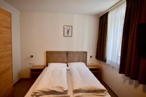 Ένα ή περισσότερα κρεβάτια σε δωμάτιο στο Haus Kanzel