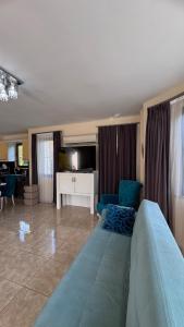 a living room with a large bed and a couch at Dalyan Turaman private pool sleeps 10 in Ortaca