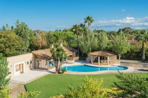 an aerial view of a house with a swimming pool at Ca Na Catalina in Pollença