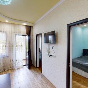 TV a/nebo společenská místnost v ubytování New Garni 2