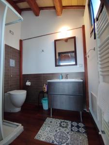 a bathroom with a sink and a toilet at Masseria del Ponte in Pretoro