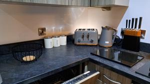 a kitchen with a counter top with appliances on it at Quayside Waters in Dundee