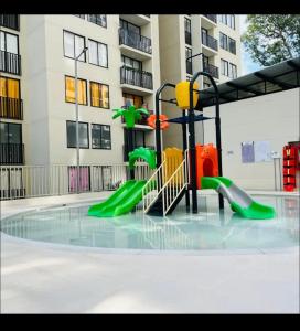 a playground in front of a apartment building at APARTAMENTO Premium in Ibagué