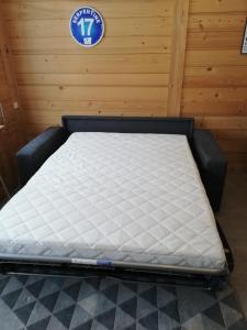 a mattress on a bed frame in a room at Apparement cosy 4 personnes in Samoëns