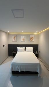 En eller flere senge i et værelse på Seasun Suítes