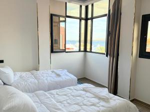 Giường trong phòng chung tại VERO Residence