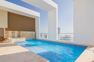 Swimmingpoolen hos eller tæt på Encantador Duplex en BOCAGRANDE confort y descanso frente al MAR