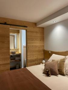 En eller flere senge i et værelse på La marmotte qui papote