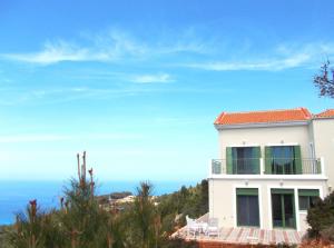 a white house with a view of the ocean at Porto Katsiki Blu in Athani