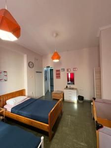 a bedroom with a bed and a desk in it at Acropolis Ermou Rooms at Plaka in Athens +90 photos