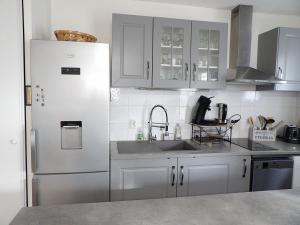 Køkken eller tekøkken på Appartement tout confort Piscine Parking