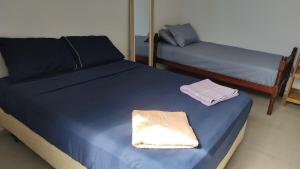 Postel nebo postele na pokoji v ubytování Sobrado Inteiro pé na areia em Itapoá!