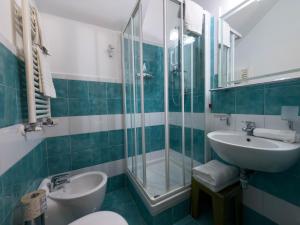 a bathroom with a sink and a shower at IL Postale in Castel di Sangro +39 photos