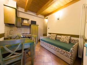 a living room with a couch and a table at IL Postale in Castel di Sangro