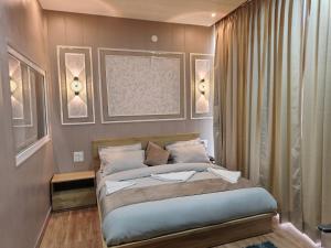 a bedroom with a bed in a room at Sunrise Vista Resort & Hotel in Bāgeshwar +8 photos
