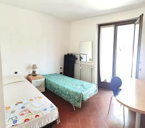 En eller flere senge i et værelse på Villa Mirasole