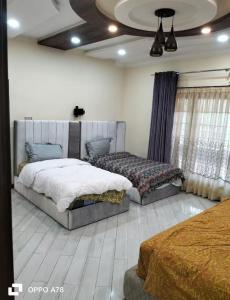 En eller flere senge i et værelse på Cottage In Changla Gali - Secluded, Cozy Stay + 14 billeder