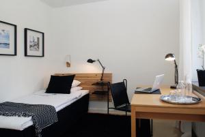 Postel nebo postele na pokoji v ubytování Ekebacken Hotell & Konferens