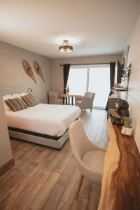 Postel nebo postele na pokoji v ubytování Étoile du Lac Lyster - Spa & Vue sur le Lac