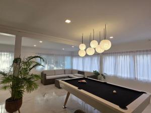 a living room with a pool table in it at Sunset Beach Villa 30m to Beach 4BR in North Pattaya