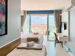 Postel nebo postele na pokoji v ubytování Fortaleza Sul Style by Holiday Stays