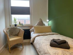 En eller flere senge i et værelse på Wolfsrudel - zentrales Motto Apartment