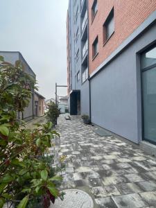a stone walkway in front of a building at Apartament in Ferizaj