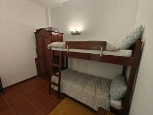 a couple of bunk beds in a room at Appartamento Rialto Terminillo in Terminillo