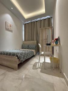 Ένα ή περισσότερα κρεβάτια σε δωμάτιο στο Emira Property