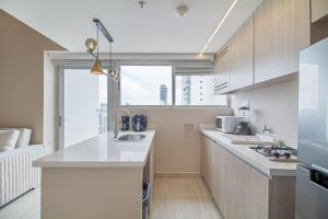 Køkken eller tekøkken på Encantador Duplex en BOCAGRANDE confort y descanso frente al MAR