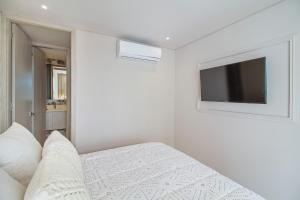 Et tv og/eller underholdning på Encantador Duplex en BOCAGRANDE confort y descanso frente al MAR