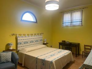 Postel nebo postele na pokoji v ubytování Open Space s'Ollastu con WiFi, Patio e Aria Condizionata