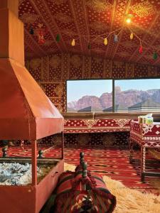 a large room with a view of the mountains at Wadi Rum Bedoun in Wadi Rum