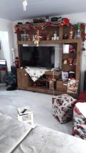 Et tv og/eller underholdning på Casa Confortável , espaçosa, proximo da praia