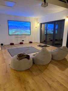 a living room with two bean bags on the floor at Polana Jelenia Głowa in Wambierzyce