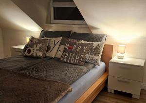 a bed with pillows on it in a bedroom at Sielskie Sitno in Sitno