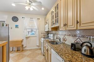 a kitchen with a sink and a refrigerator at Impeccable 1BR unit in Brooklyn in Brooklyn