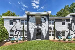 a house with a mural on the front of it at Spacious condo with easy access to Uptown in Charlotte