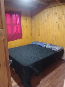 En eller flere senge i et værelse på Cabaña de descanso A 150 mt del río