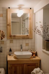 a bathroom with a sink and a mirror at Willa Tyrolczyk in Karpacz +105 photos
