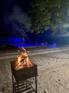 a fire pit on the beach at night at Holiday house Tbilisi in Tbilisi City