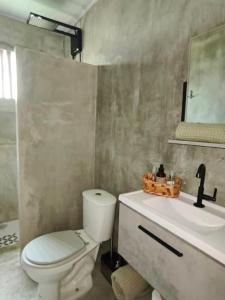 Et badeværelse på Suite privativa em Casa em Corumbau