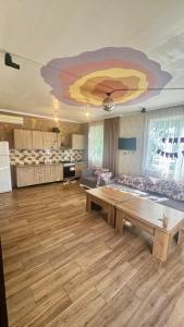 a large living room with a large painting on the ceiling at Holiday house Tbilisi in Tbilisi City