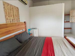 En eller flere senge i et værelse på Suite privativa em Casa em Corumbau