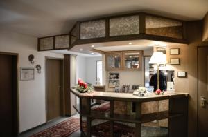 a kitchen with a large island in a room at Hotel Rössle in Schongau