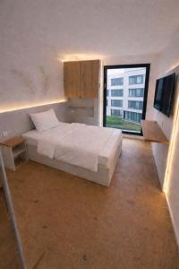 En eller flere senge i et værelse på Evermore Nürnberg - Fürth