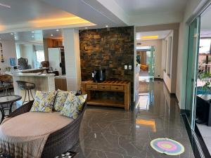 a living room with a couch and a table at Hotel Sítio Novo in Piratuba
