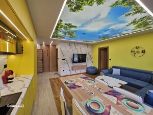 a living room with a large skylight in the ceiling at Apartman Blue Sky in Jahorina